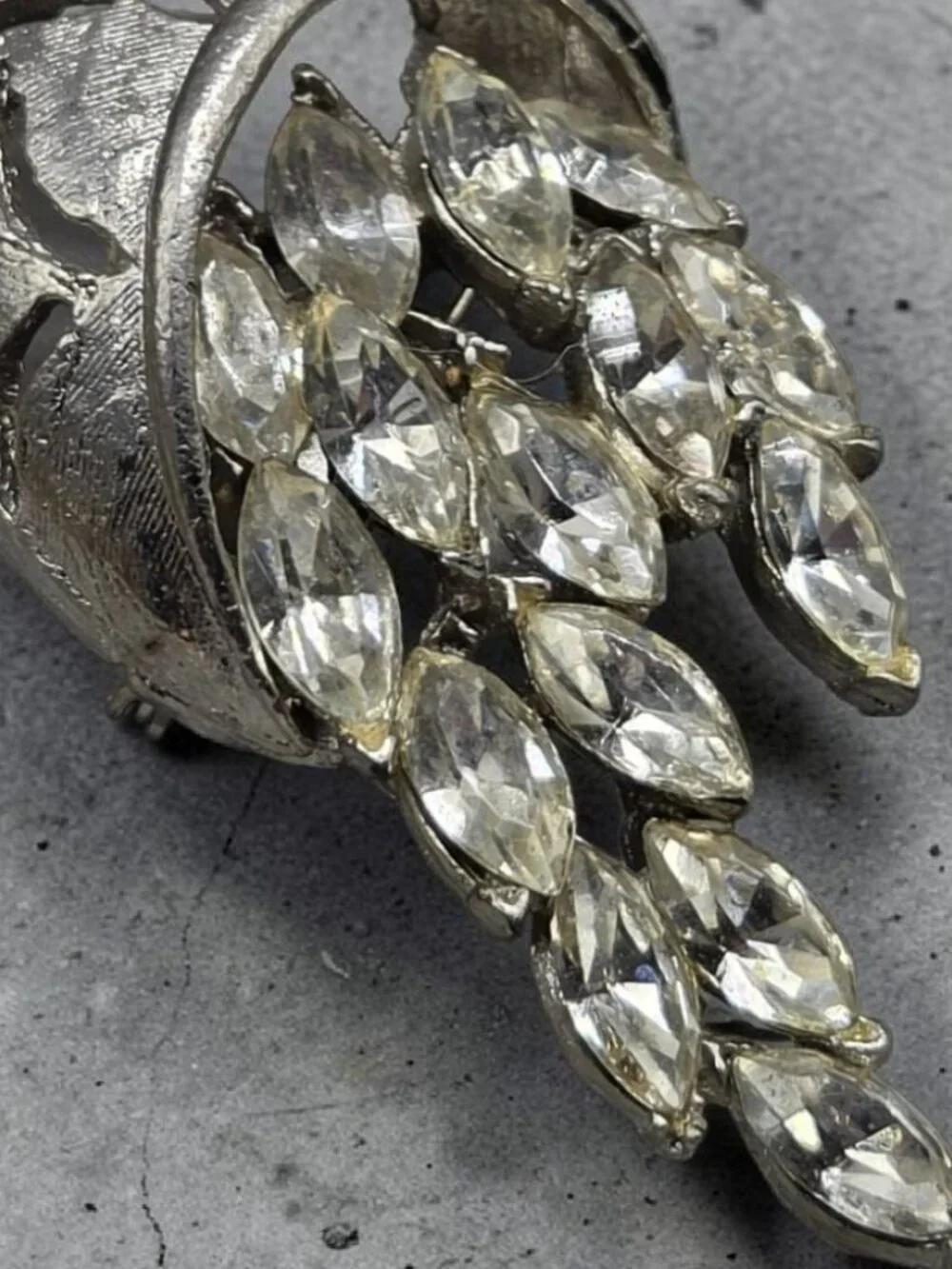 None this brooch